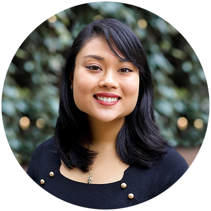 Professional headshot example of woman with natural background