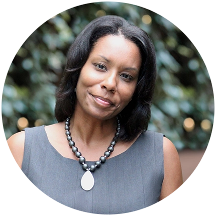 Professional headshot example of woman with natural background