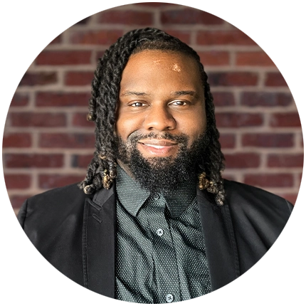 Professional headshot example of man with brick background