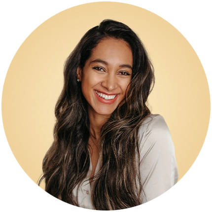 Casual headshot example of woman on yellow background.