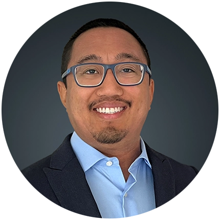 Corporate headshot example of man on dark grey backdrop