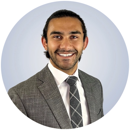 Corporate headshot example of man on light blue backdrop