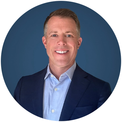 Corporate headshot example of man on blue backdrop