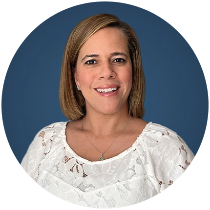 Corporate headshot example of woman on blue backdrop