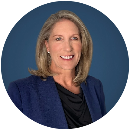 Corporate headshot example of woman on blue backdrop