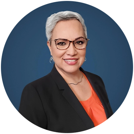 Corporate headshot example of woman on blue backdrop