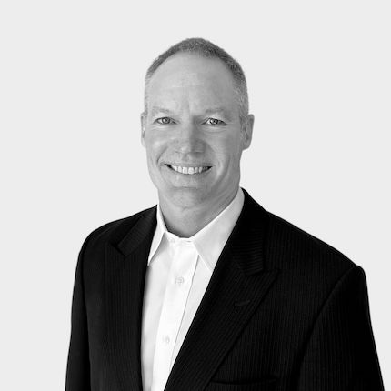 Corporate headshot example of man in black and white.