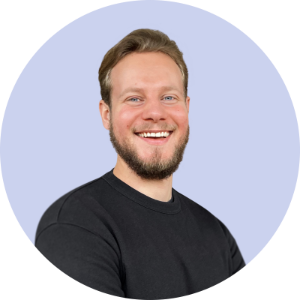 Remote headshot example of man smiling on light purple backdrop.