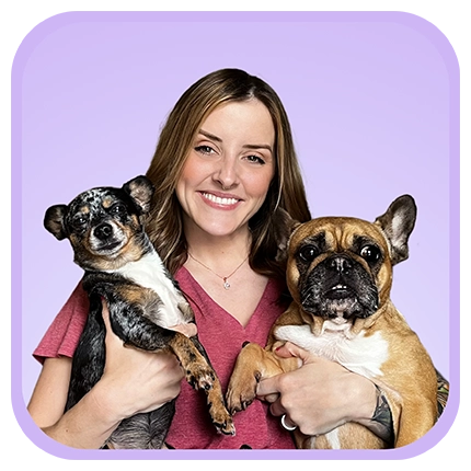 Playful headshot example of woman on purple background with two dogs