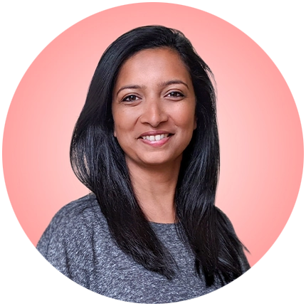 Playful headshot example of woman on pink background